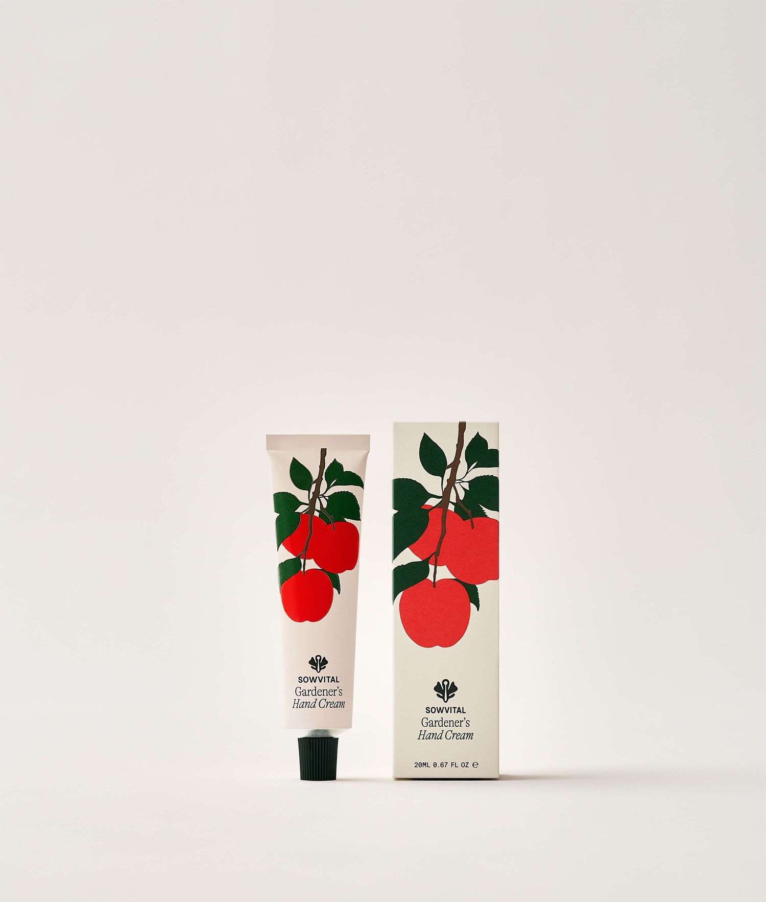 Hand cream tube and packaging with apple design on a white background