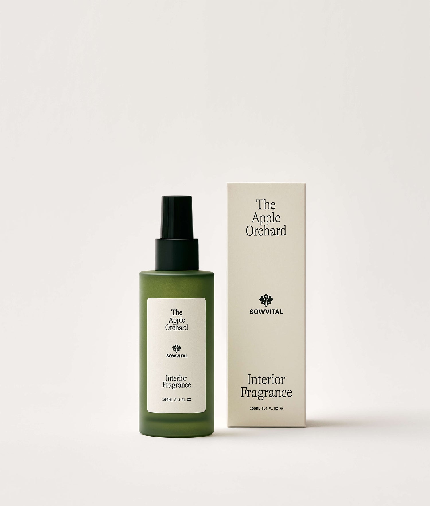 Green interior fragrance bottle and packaging labeled 'The Apple Orchard' on a white background