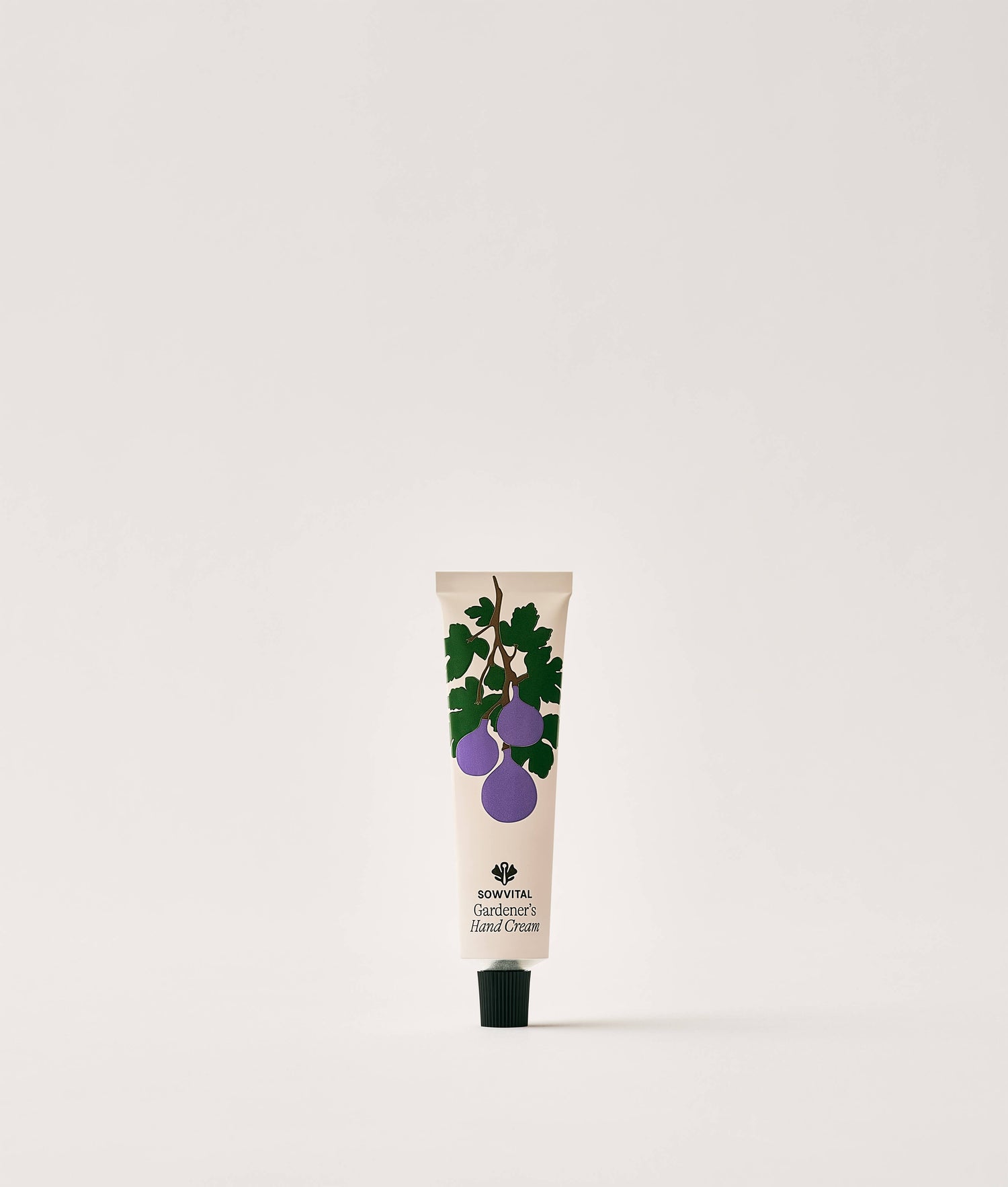 Hand cream tube with fig design on a white background