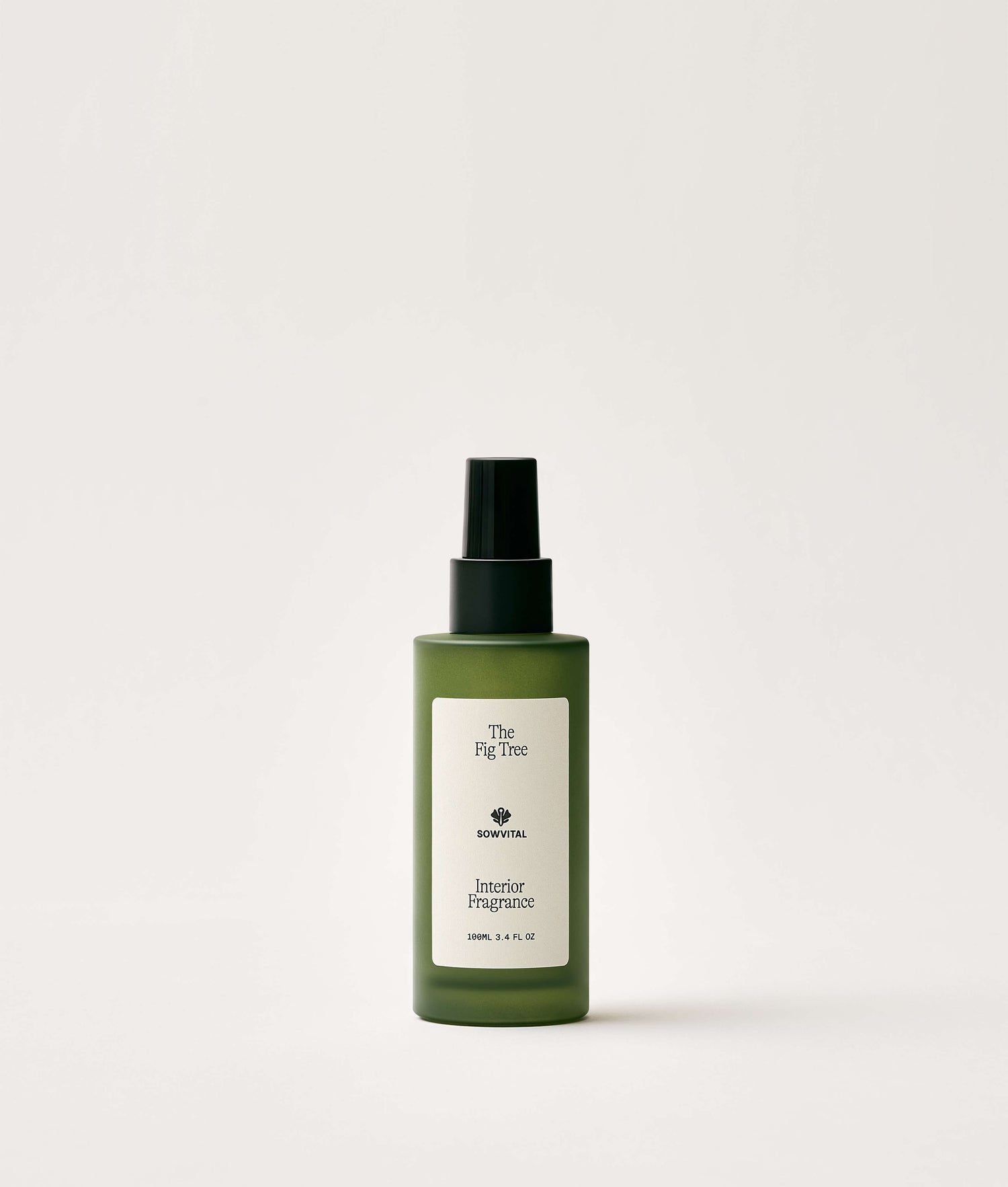 Green bottle of interior fragrance on a white background