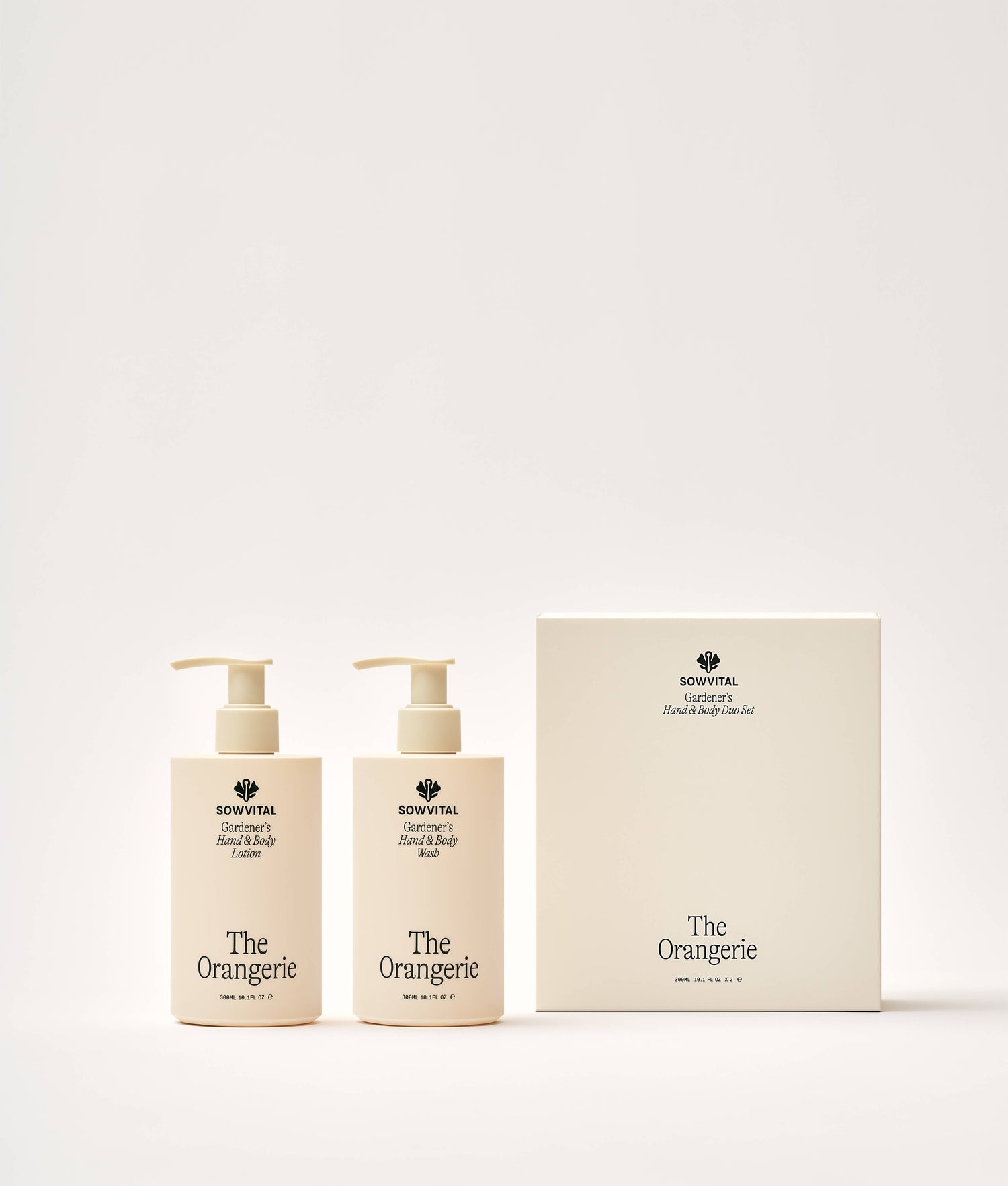 Two bottles of 'The Orangerie' hand and body lotion with a matching box on a white background.