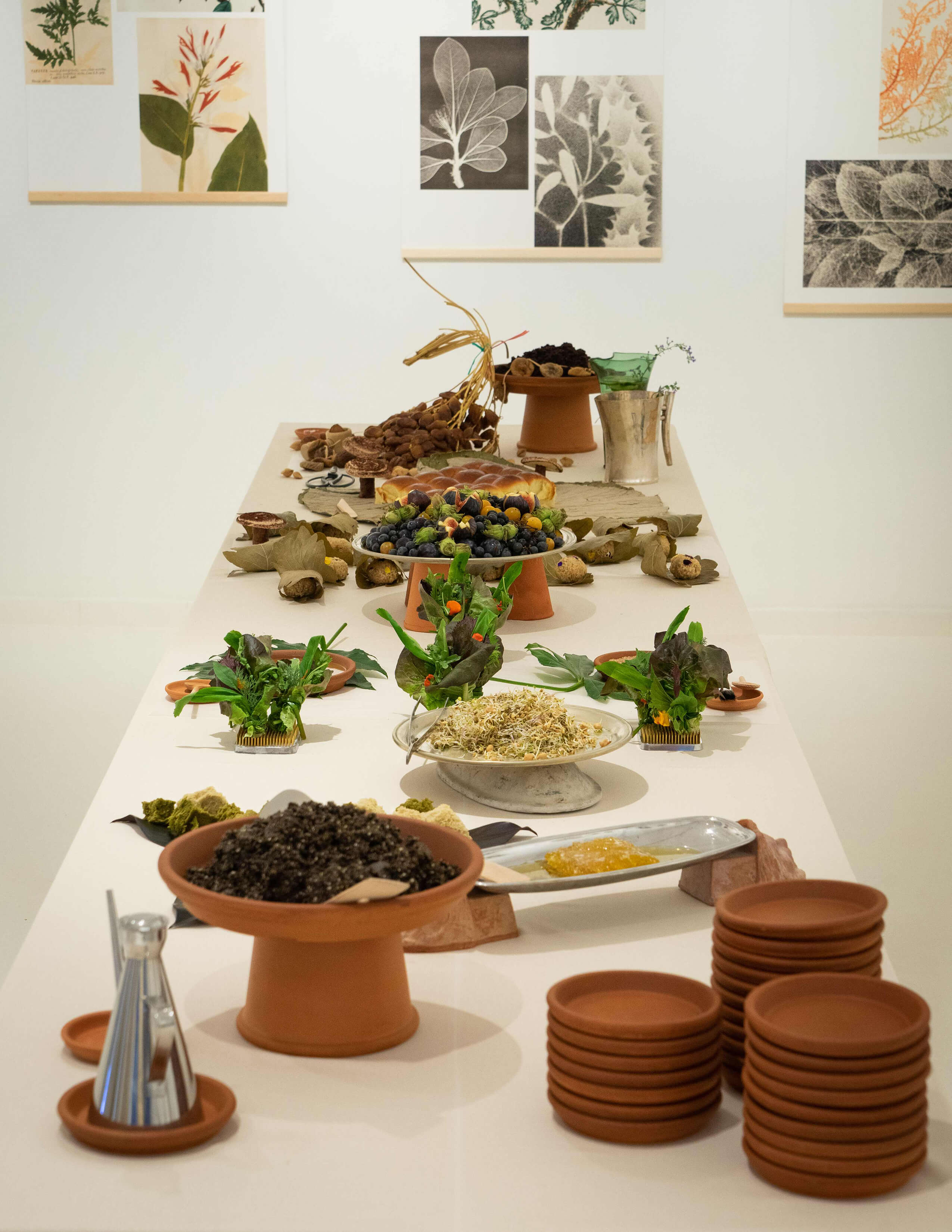 A vertical angle photograph of a table of vegetarian food.