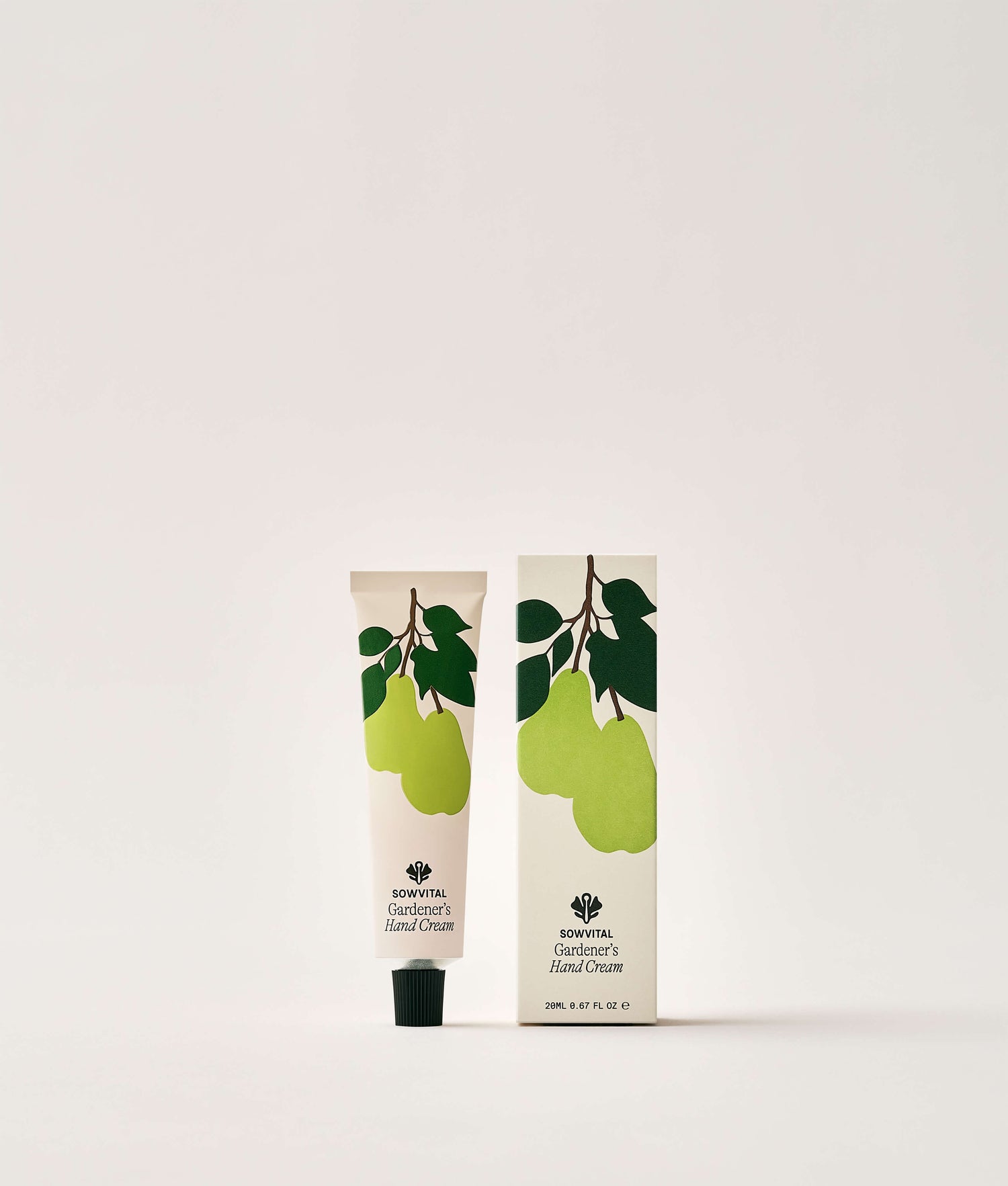 Hand cream tube and packaging with pear design on a white background