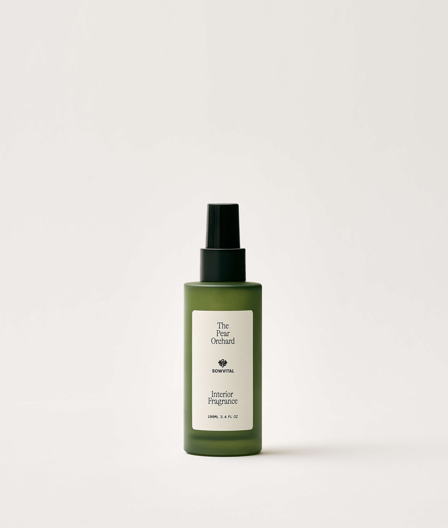 Green bottle of interior fragrance on a white background