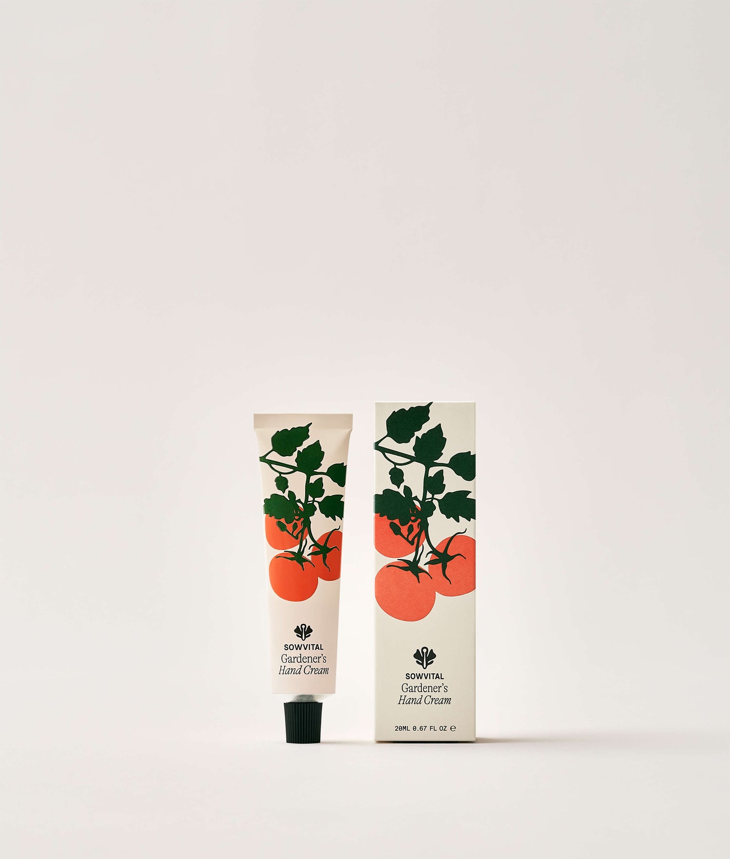 Hand cream tube and packaging with tomato design on a white background