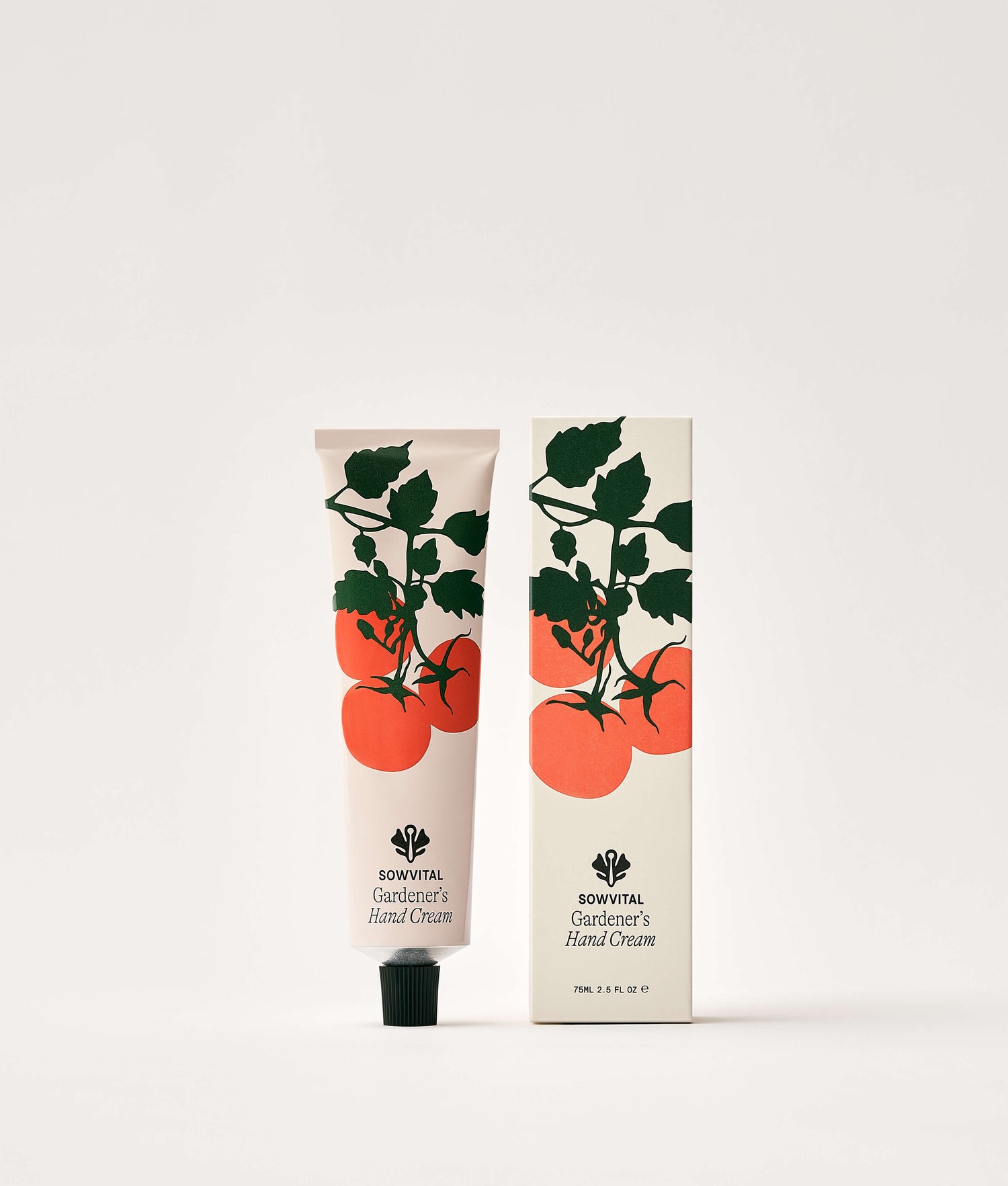 Hand cream tube and packaging with tomato design on a white background