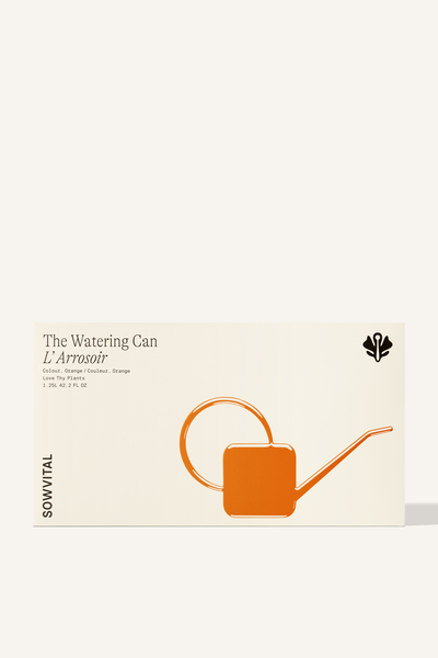 A wide rectangular box with an orange embossed illustration indicating the colour of the watering can contained within.