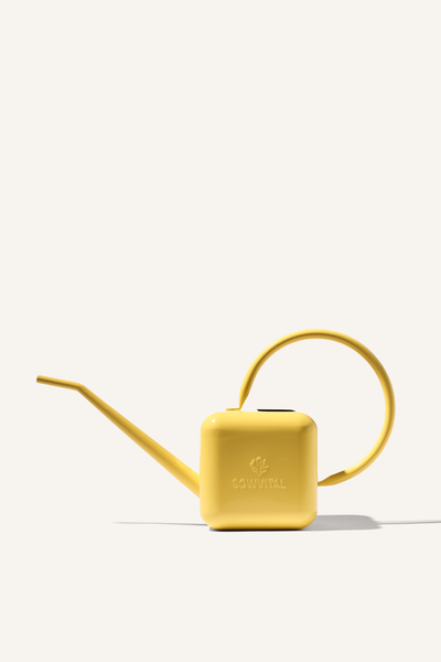 A yellow stainless steel watering can, embossed with the Sowvital logos.