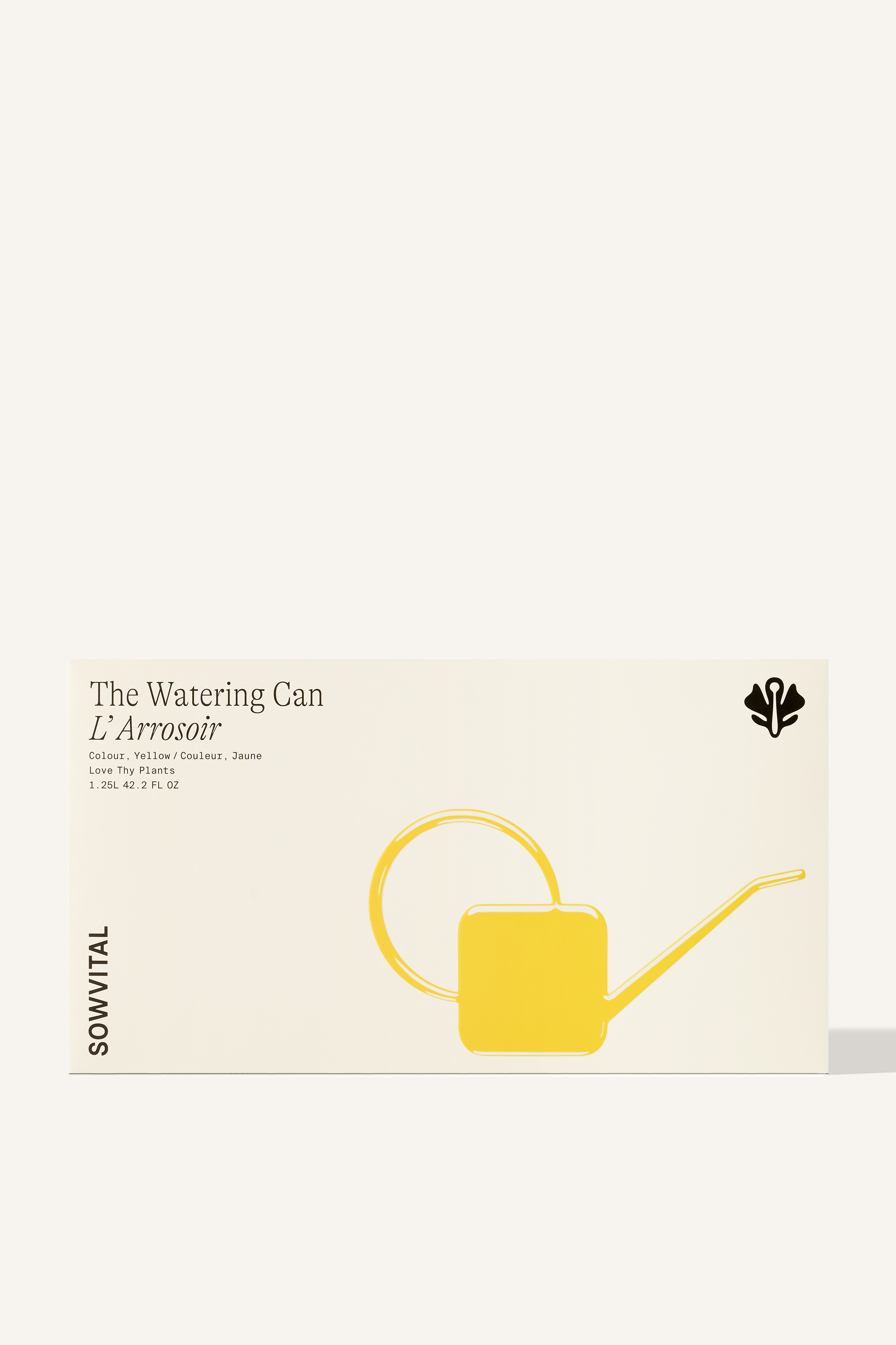 A wide rectangular box with a yellow embossed illustration of the watering can contained within.