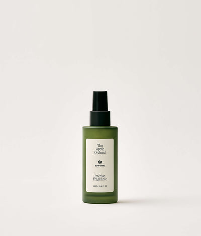 Green bottle of interior fragrance on a white background