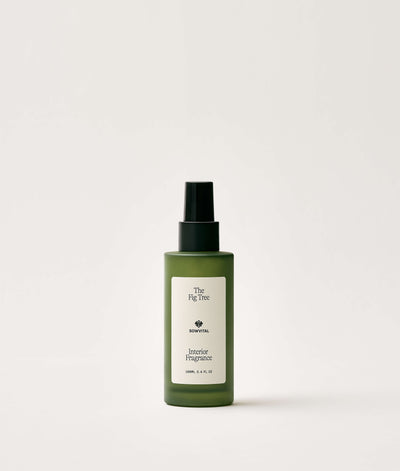 Green bottle of interior fragrance on a white background