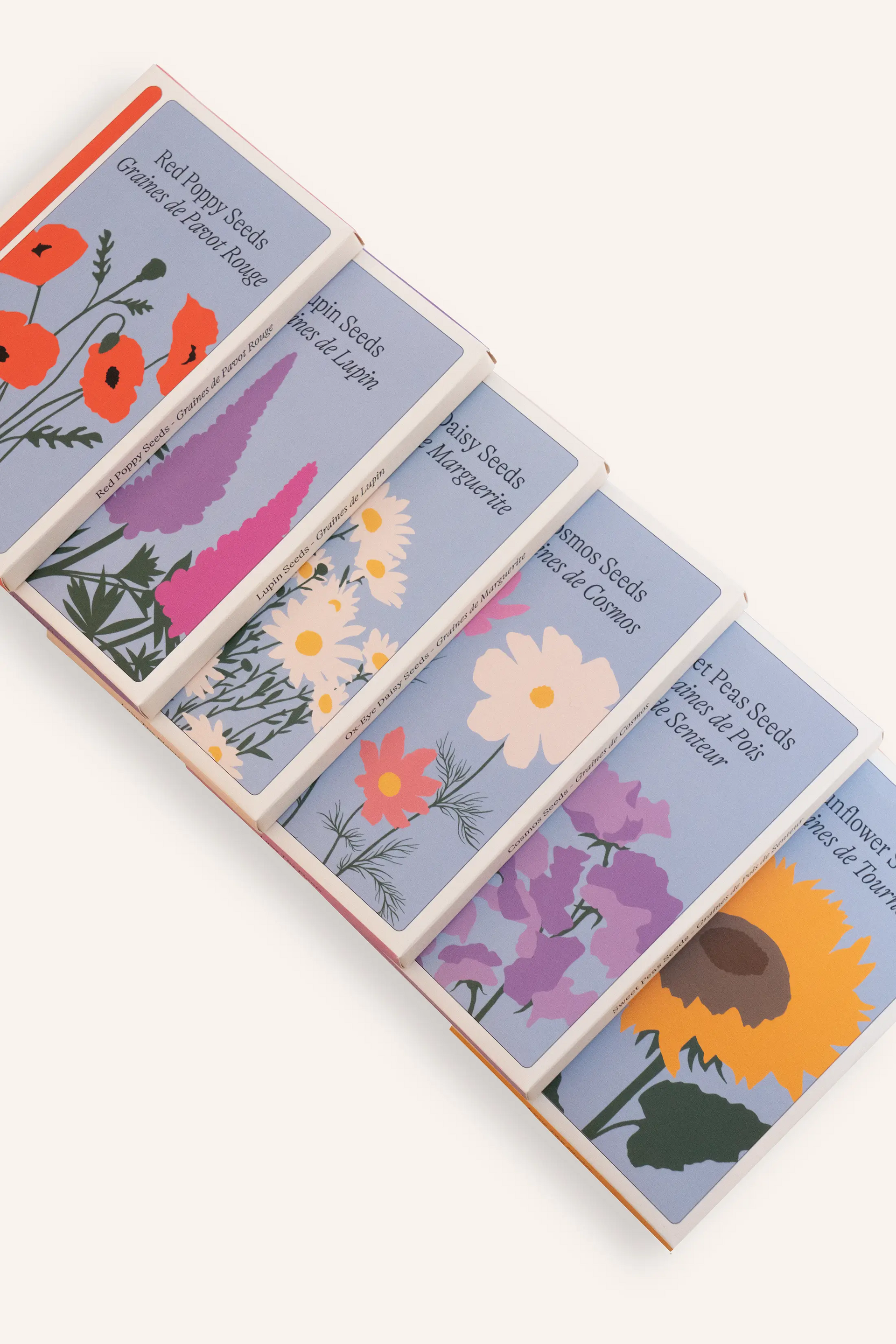 The Sowvital flower seed collection that includes: red poppy, lupin, daisy cosmos, sweet pea and sunflower seeds.