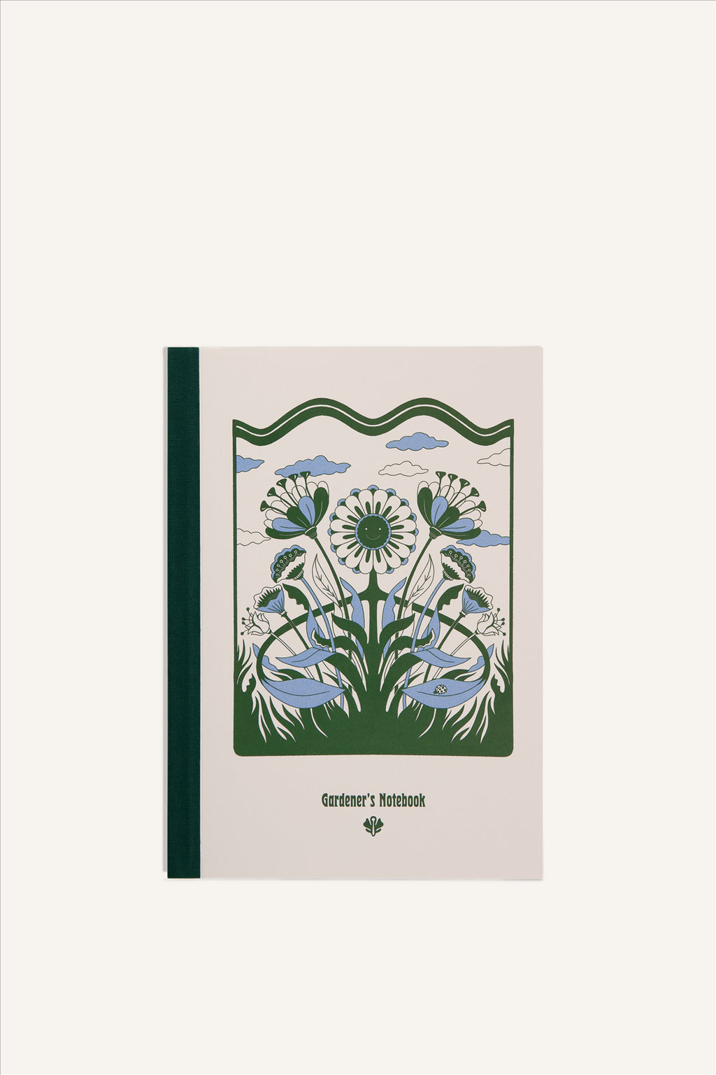 An A5 notebook with a beige cover and green cloth spine. The cover shows a green and blue illustration of a smiling flower in grass, with clouds in the background. The background of the image is beige.