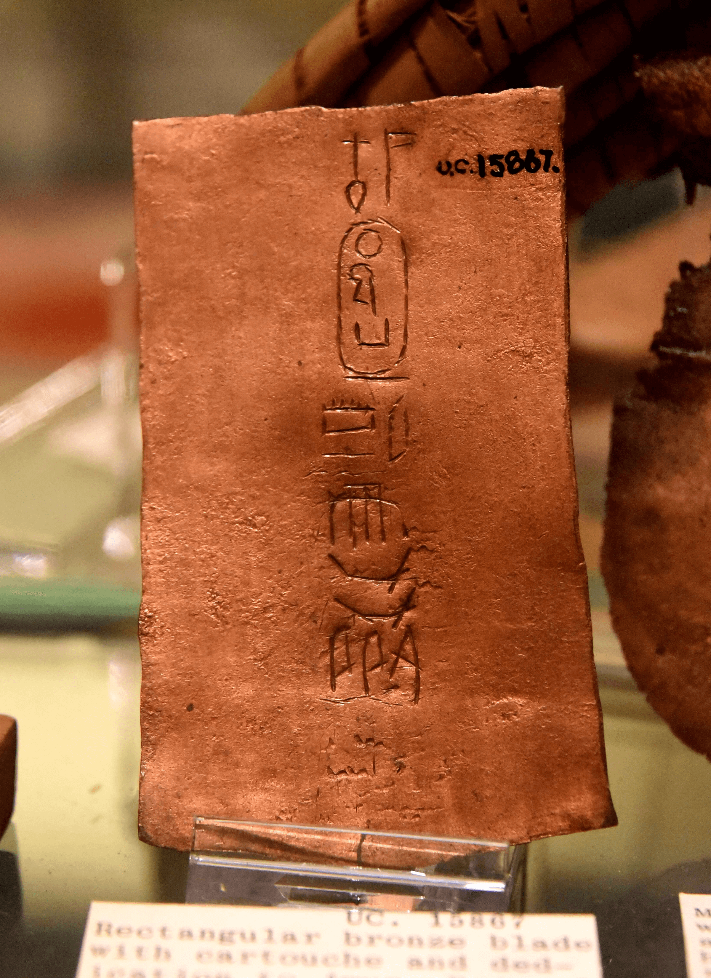 Copper or bronze sheet bearing the name of Hatshepsut. From a foundation deposit in "a small pit covered with a mat" found at Deir el-Bahri, Egypt. 18th Dynasty. The Petrie Museum of Egyptian Archaeology, London.