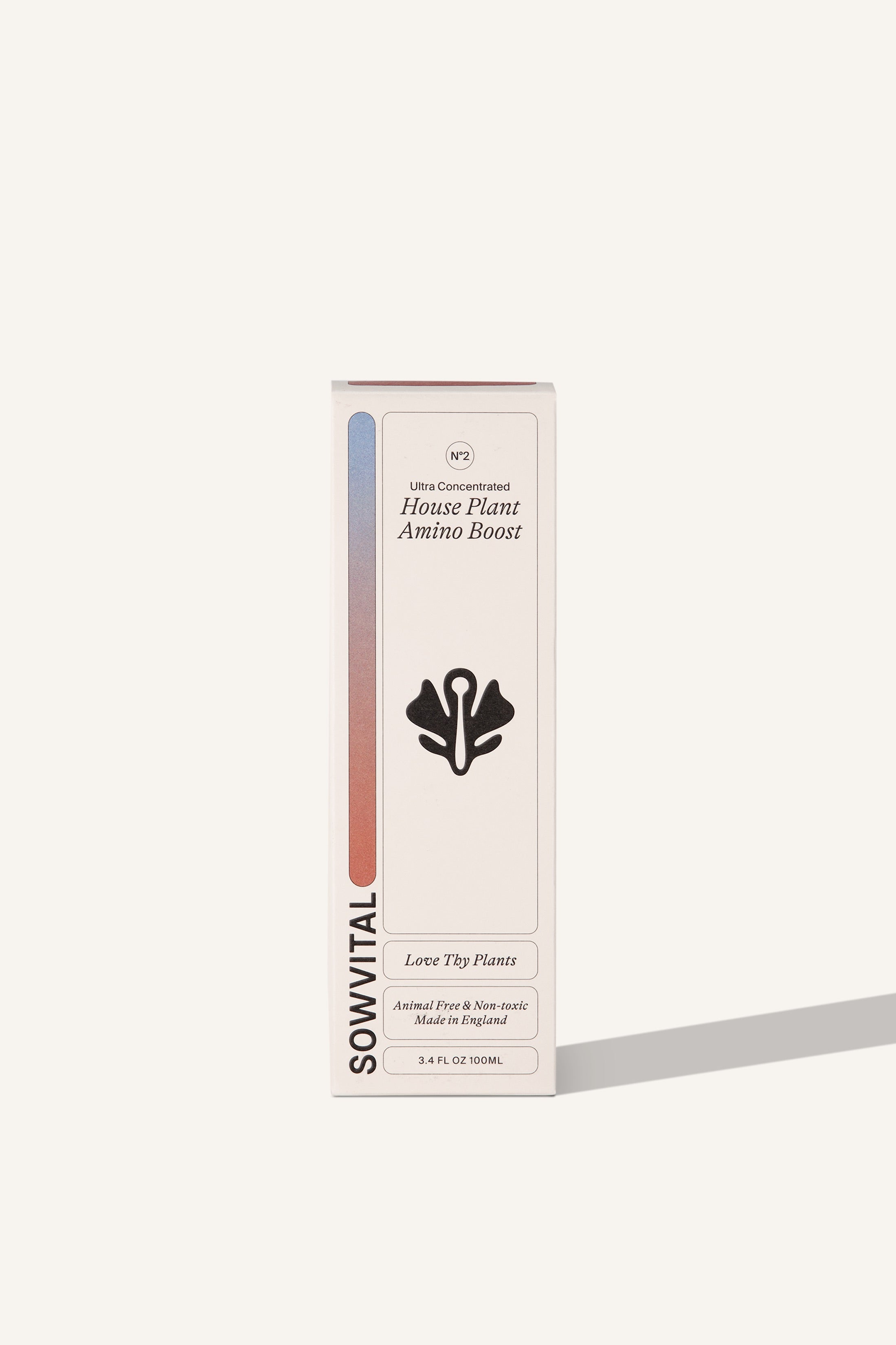 The House Plant Amino Boost box, a tall rectangular fedrigoni paper box in beige. The front of the box has a coloured gradient on the left hand side. The background is beige.