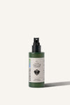 The Sowvital Aqua Leaf Cleanser, a 100ml green glass bottle with a spray top and beige label. The background is beige.