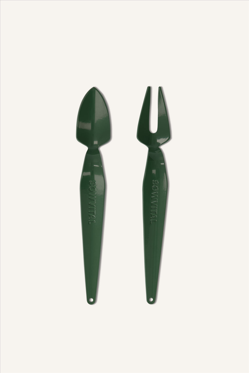 The House Plant Tool Set, two green stainless steel hand tools. One is a trowel and one is a fork. They have a glossy finish, are stamped with "SOWVITAL", and have holes in the ends for hanging.