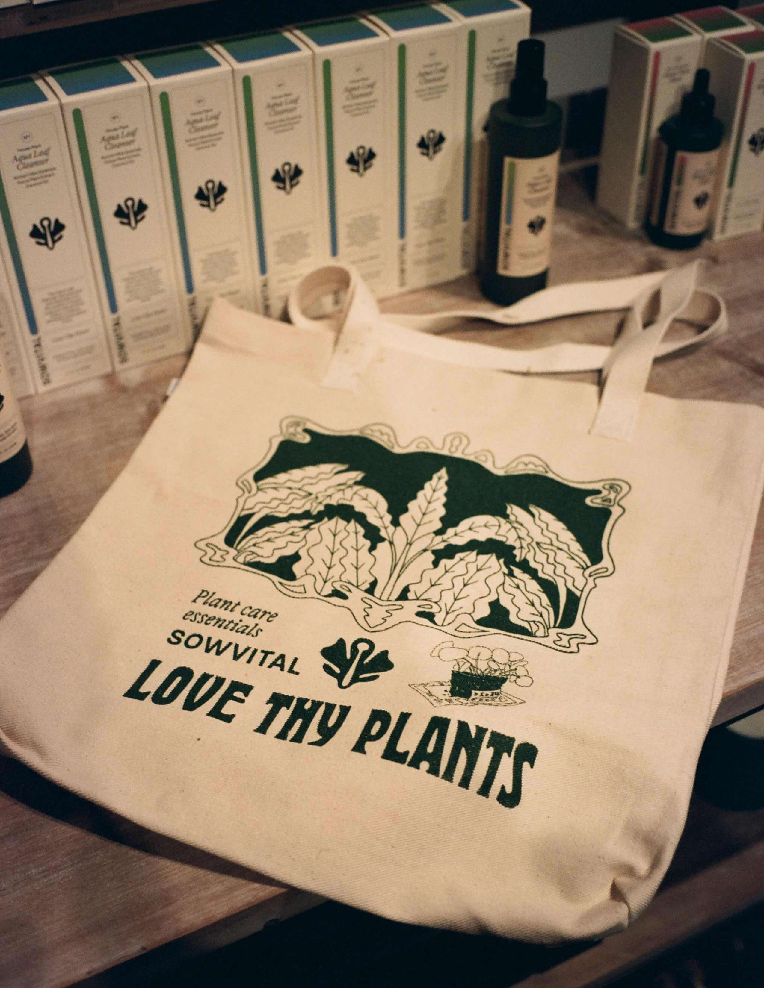 Sowvital - Love Thy Plants tote bags and house plant products with packages on.