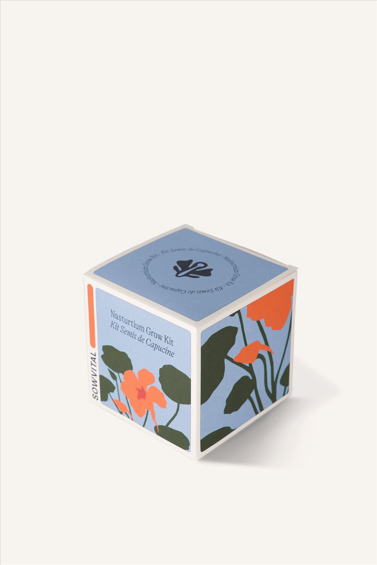 Sowvital's Nasturtium Seed Grow Kit from a corner angle. A square fedrigoni paper box with a playful illustration of nasturtium on the front and sides. The background is beige.