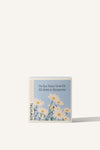 Sowvital's Ox-Eye Daisy Seed Grow Kit. A square fedrigoni paper box with a playful illustration of daisies on the front. The background is beige.