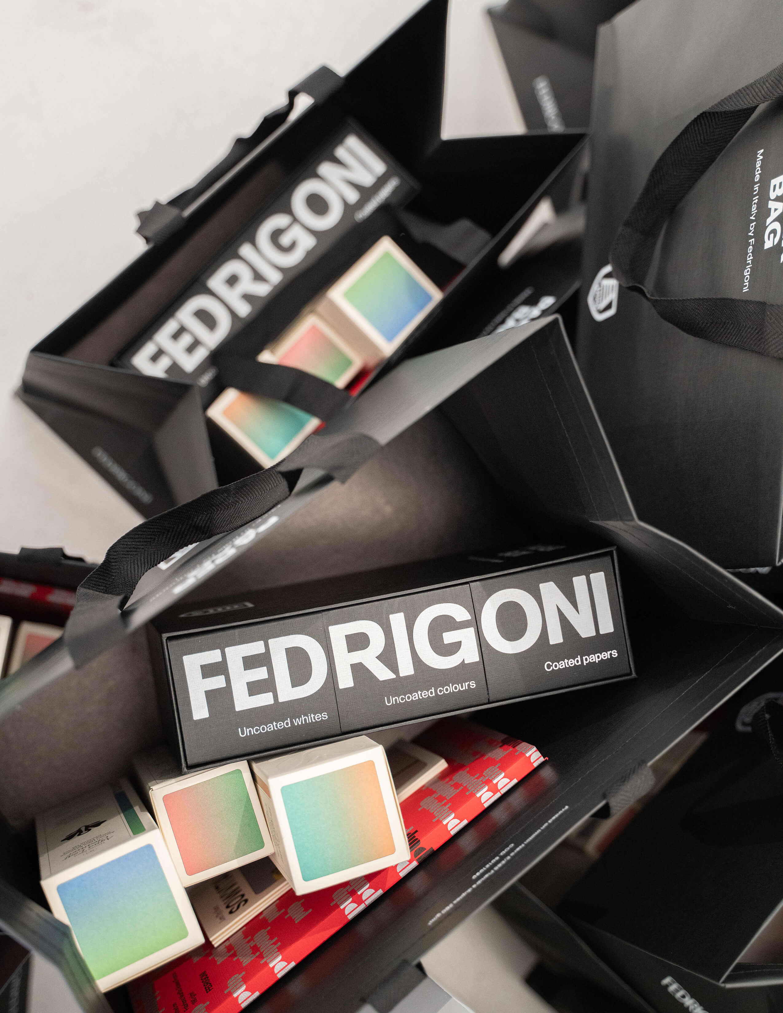 Fedrigoni’s uncoated, coated, coloured paper contents with the Sowvital products’ packaging in black bags.