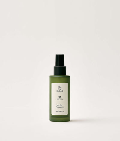 Green bottle of interior fragrance on a white background