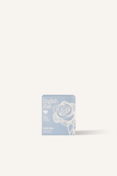 A square, blue fedrigoni paper box with a beige illustration of a rose on the front.