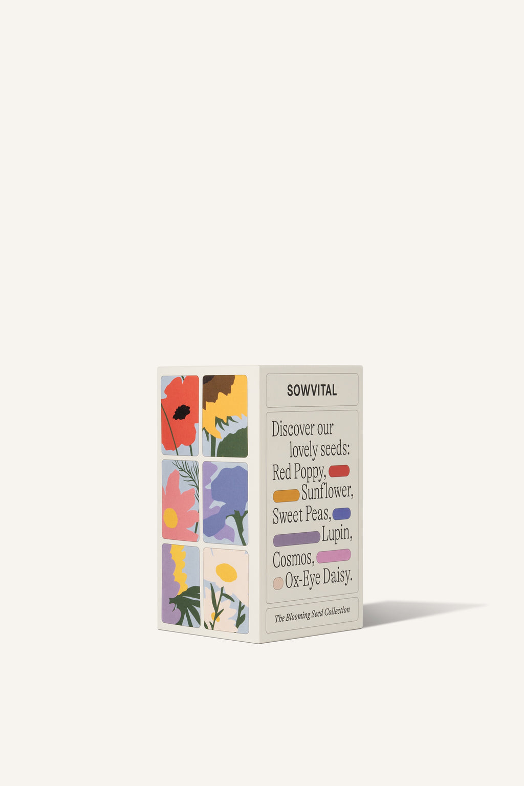 Sowvital's Flower Seed Collection from a corner angle. A rectangular fedrigoni paper sleeve describing the varieties found inside, Red Poppy, Sunflower, Sweet Peas, Lupin, Cosmos, and Ox-Eye Daisy. The background is beige.