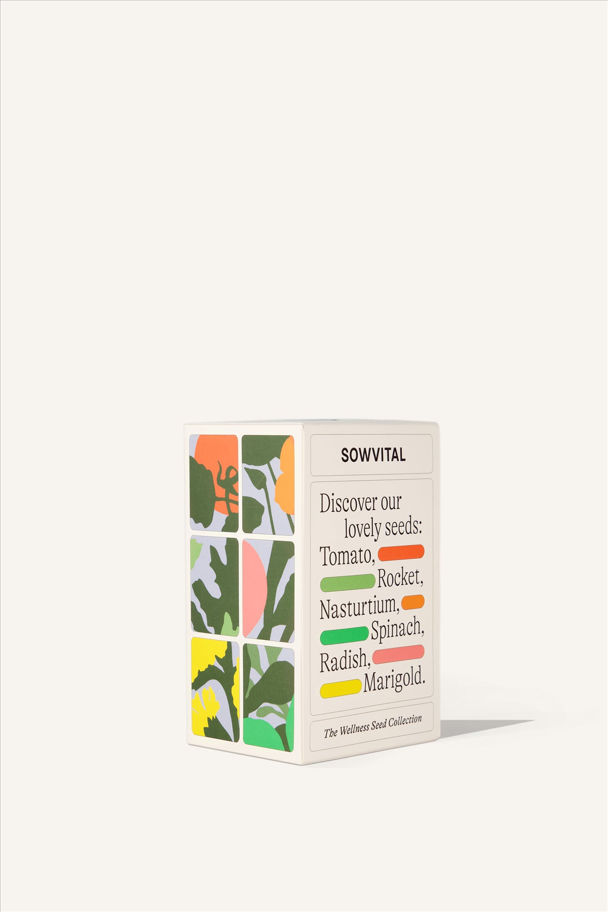 A rectangular beige paper box, illustrated on one side with six different varieties of plant which are described on the other side. Tomatoes, Rocket, Nasturtium, Spinach, Radish, and Marigold.