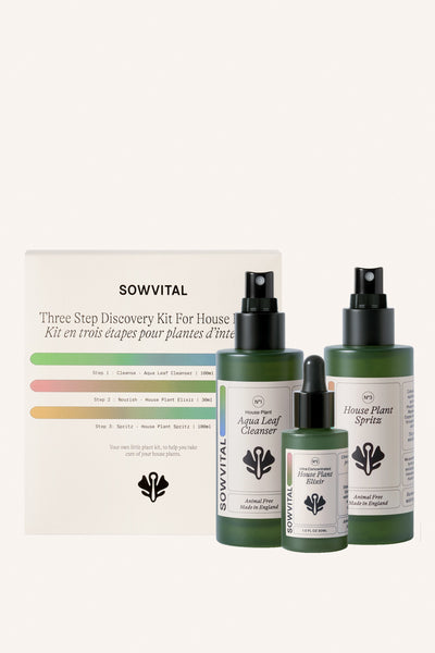 Three green glass bottles of houseplant fertiliser are sat alongside the box they come inside. Two are 200ml, one is 30ml.