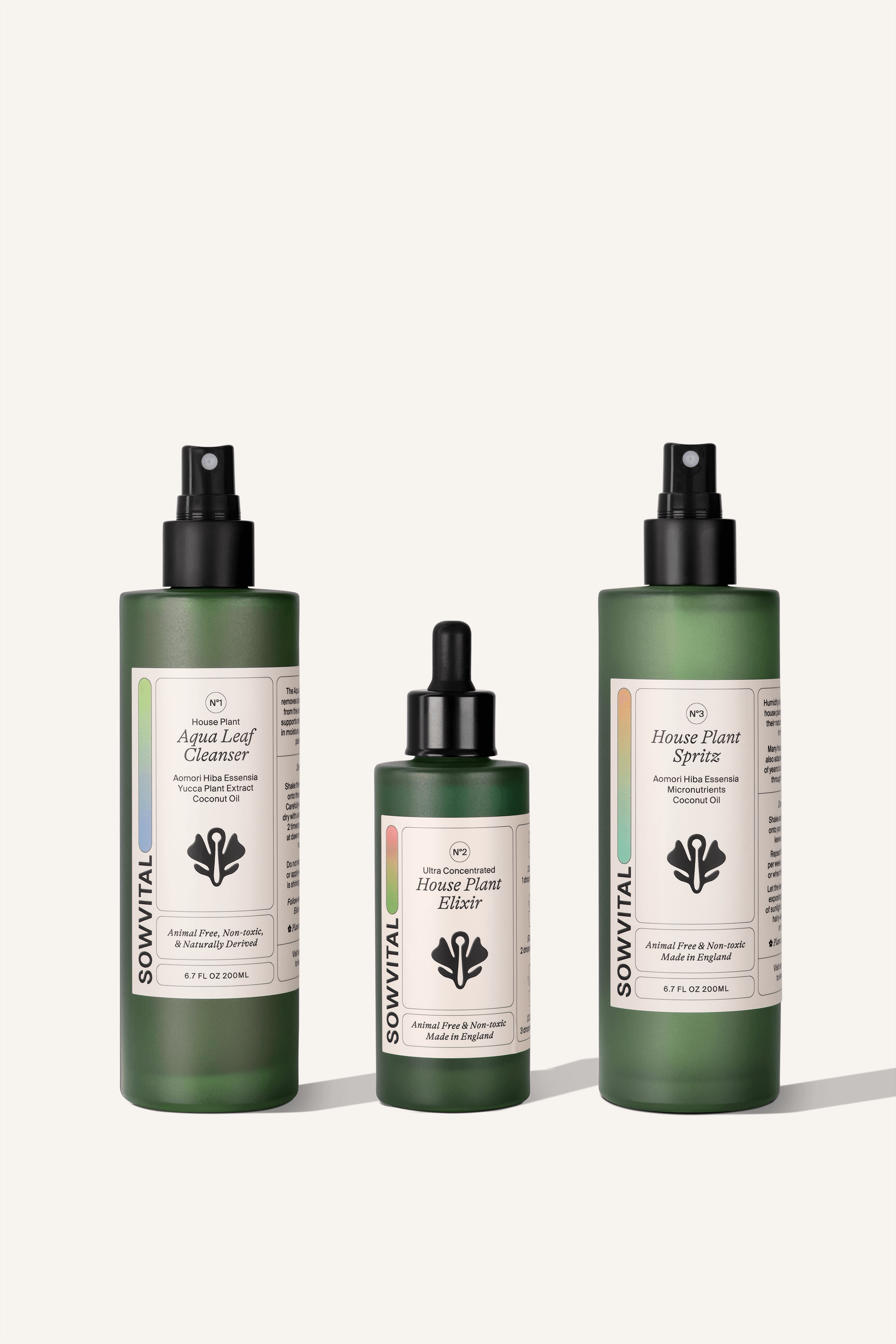 Three green glass bottles side by side. The Aqua Leaf Cleanser, The House Plant Elixir, and the House Plant Spritz.