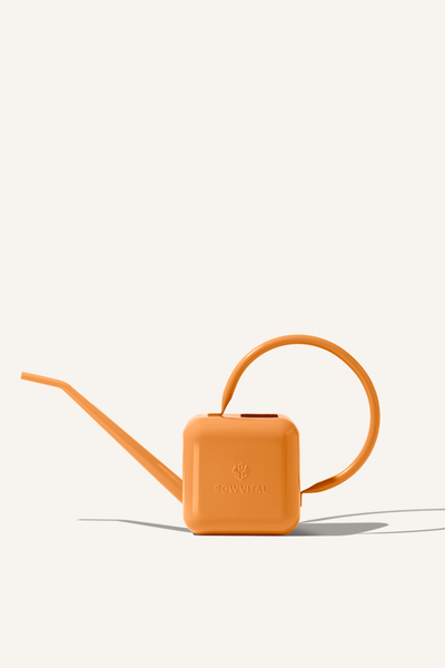 An orange stainless steel 1.25 litre watering can, embossed with the Sowvital logos.