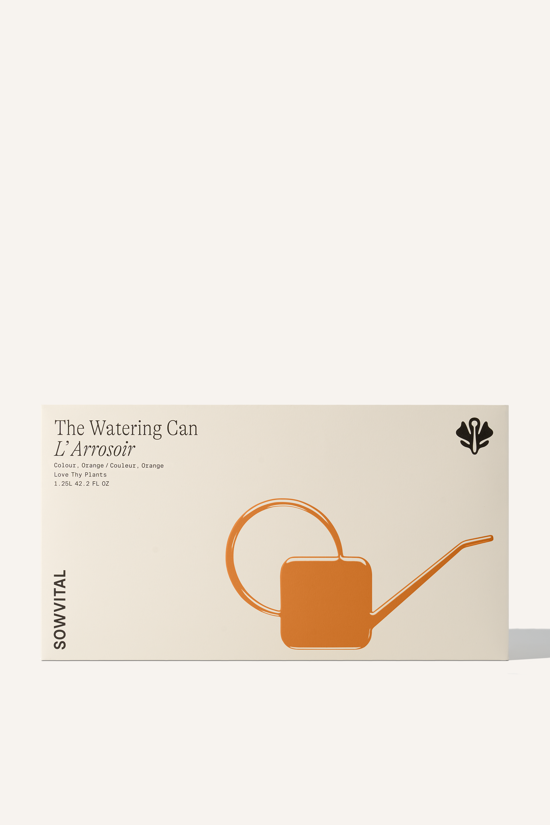 A wide rectangular box with an orange embossed illustration indicating the colour of the watering can contained within.